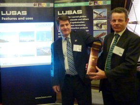 Ron Watson of R.J. Watson Inc draws the winning card as Terry Cakebread of LUSAS holds the container
